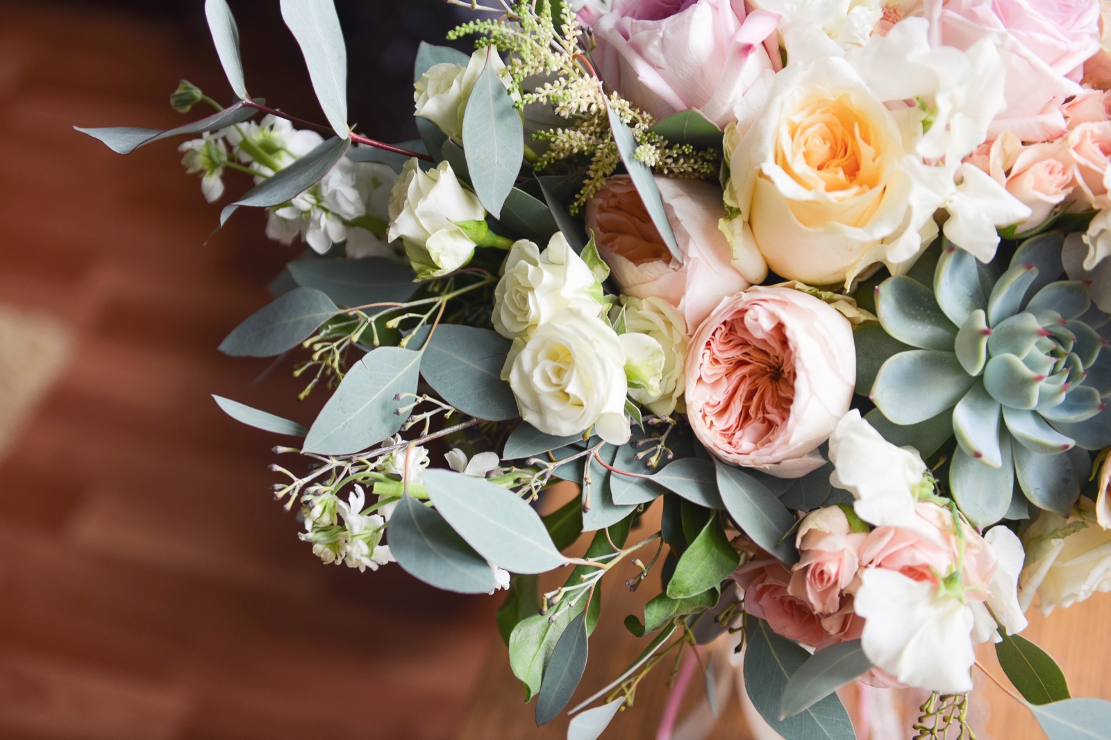 Bridal bouquet with garden roses, eucalyptus, and succulents